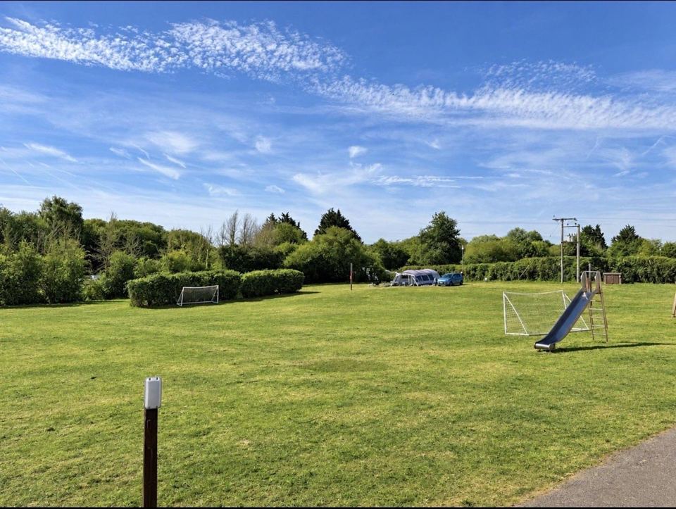 Open field with goalposts and slide