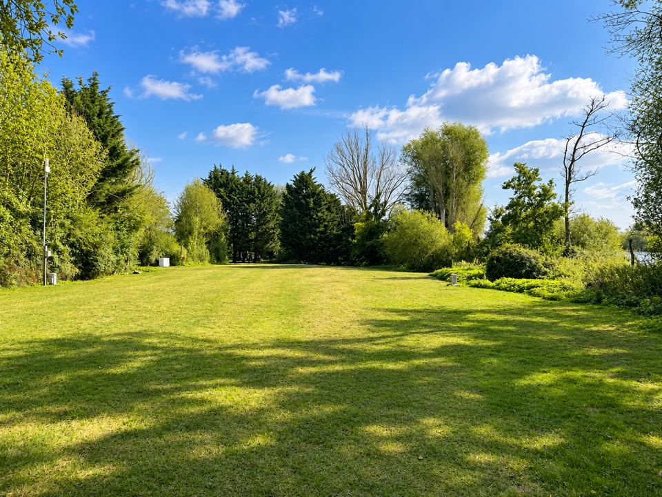 Open grass field in sunshine