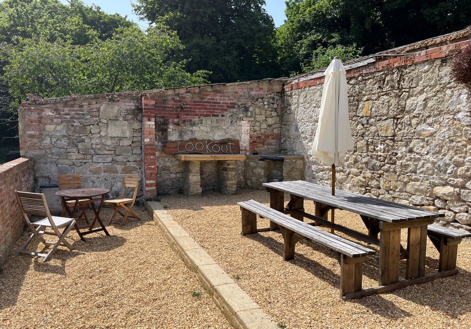 Picnic tables in the walled courtyard