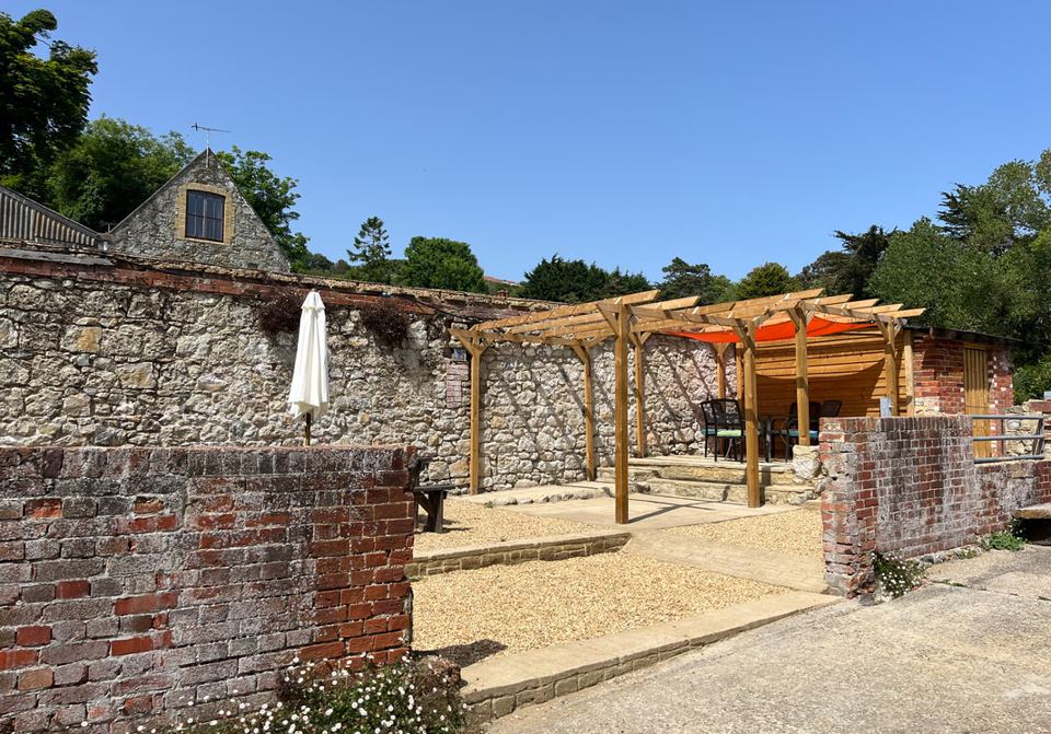 Walled courtyard with pergola