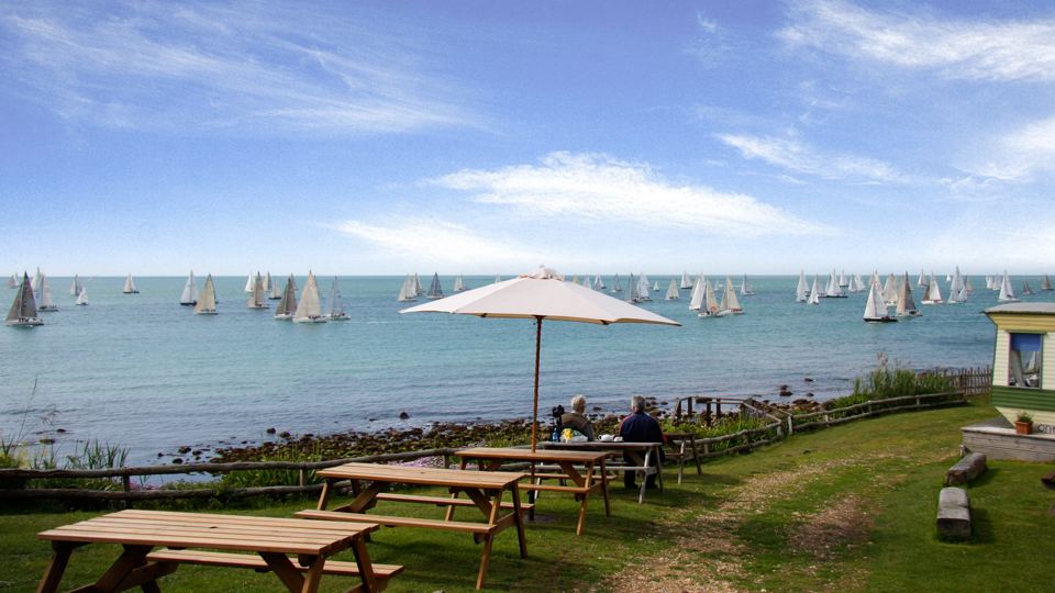 Picnic benches above the shore