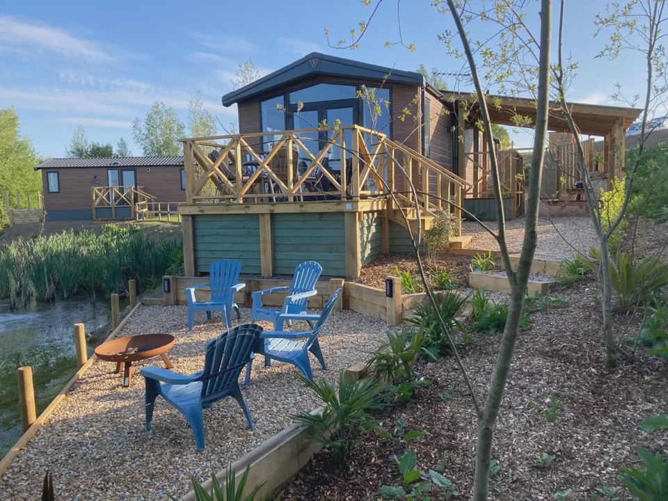 Lodge deck with fire pit and chairs