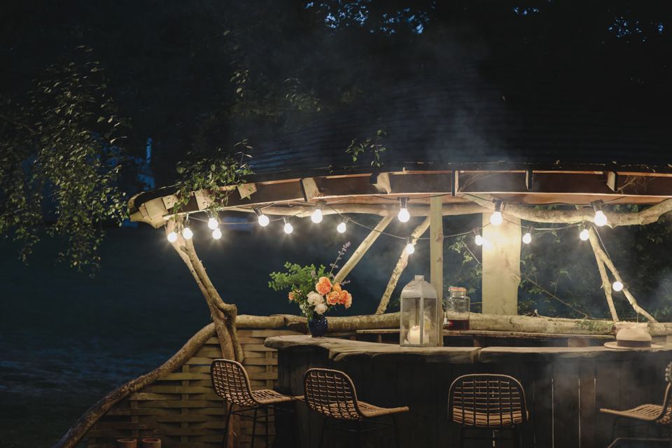 Outdoor bar lit up at night