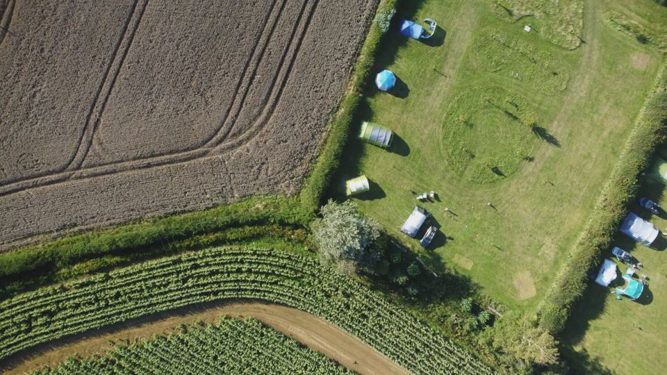 Tents beside the farm fields