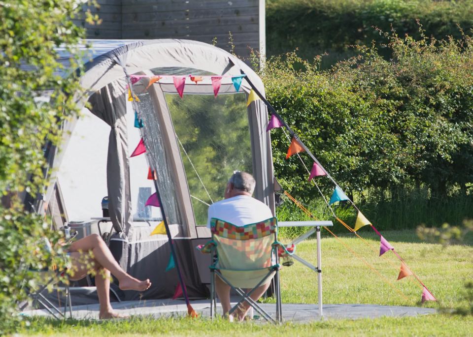 Tent with bunting and chairs