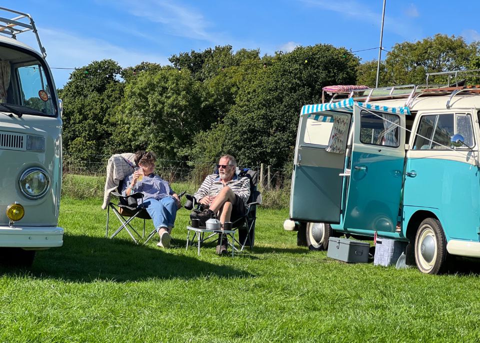 Campers by their VW buses