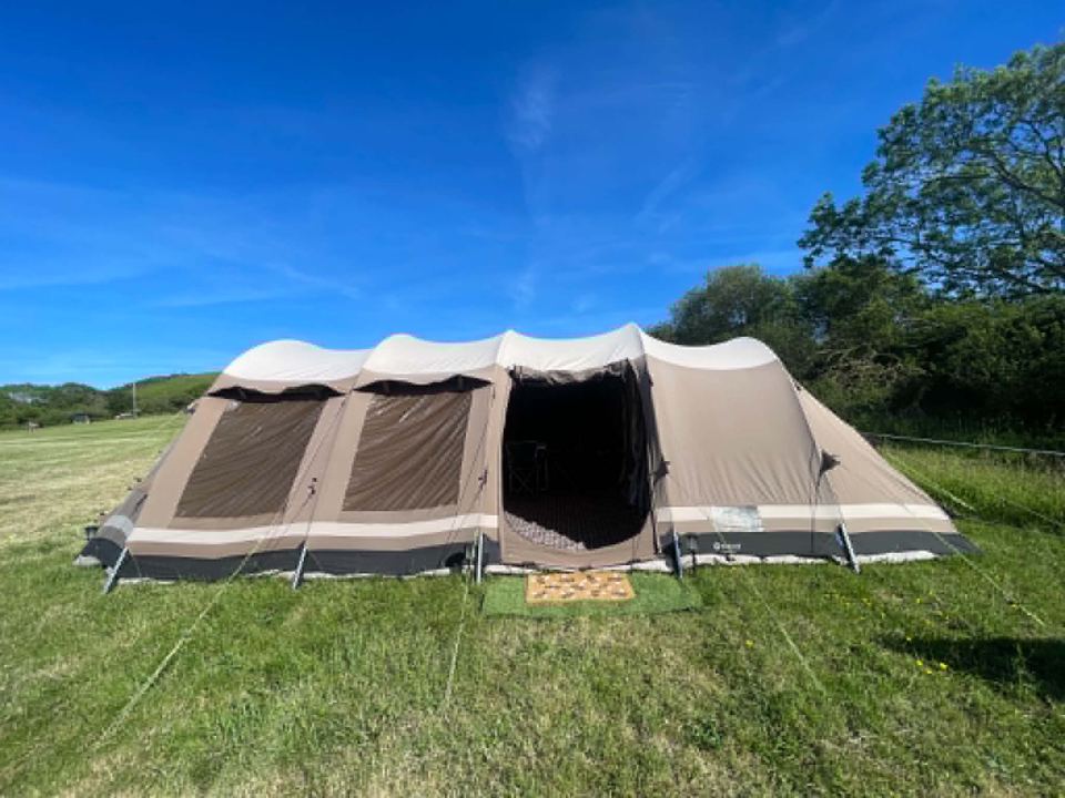 Large family tent in the meadow