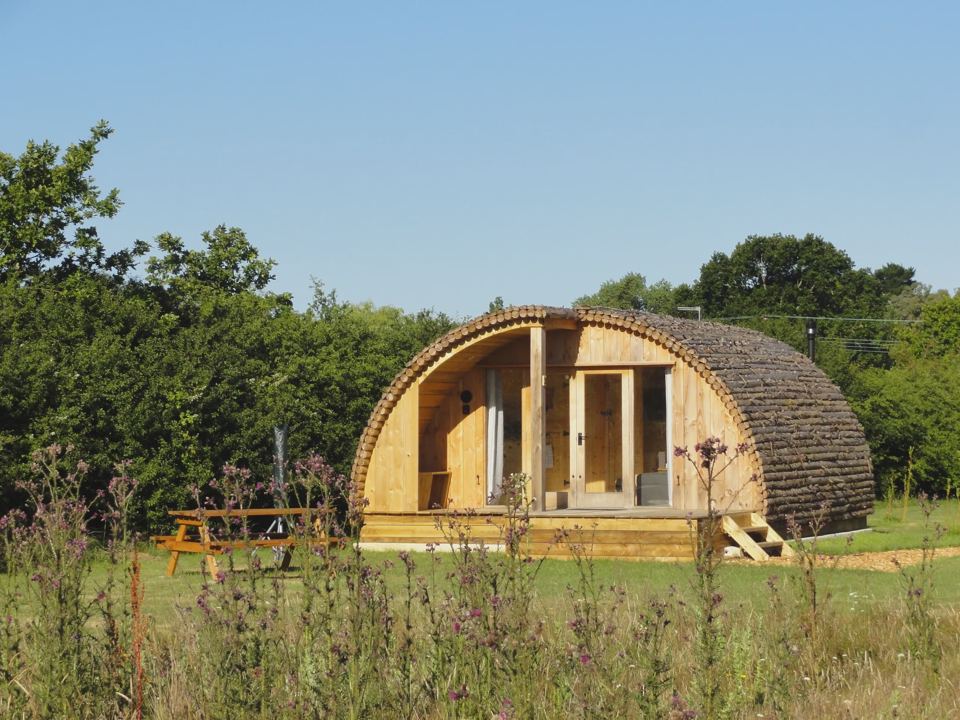 Wooden cabin in the meadow