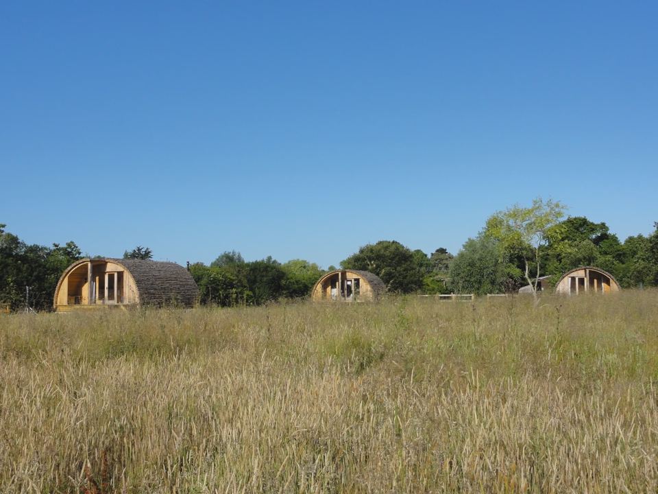 Three cabins across the meadow