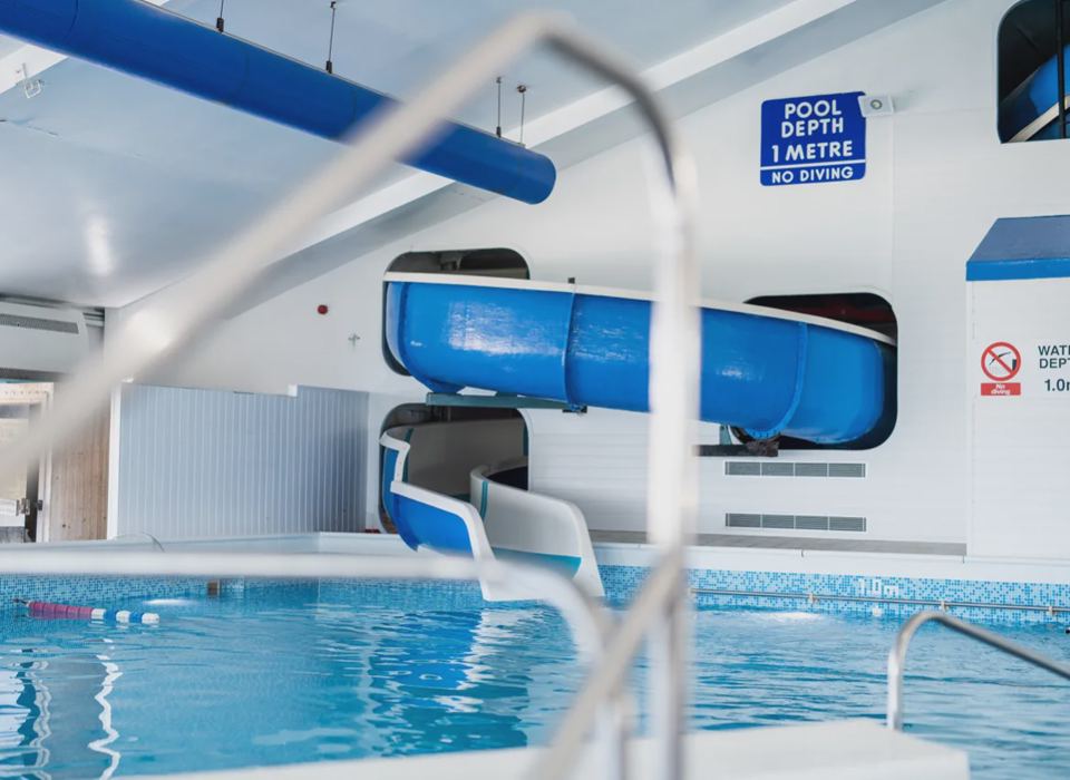 Indoor pool with flume