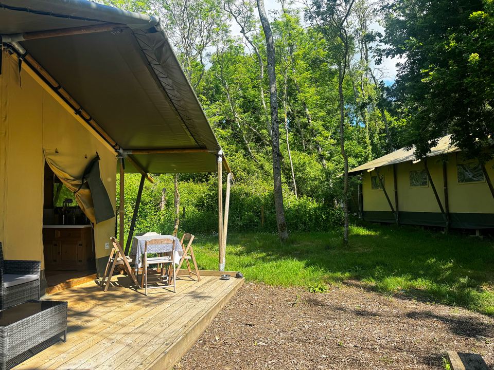 Safari tent decks among trees