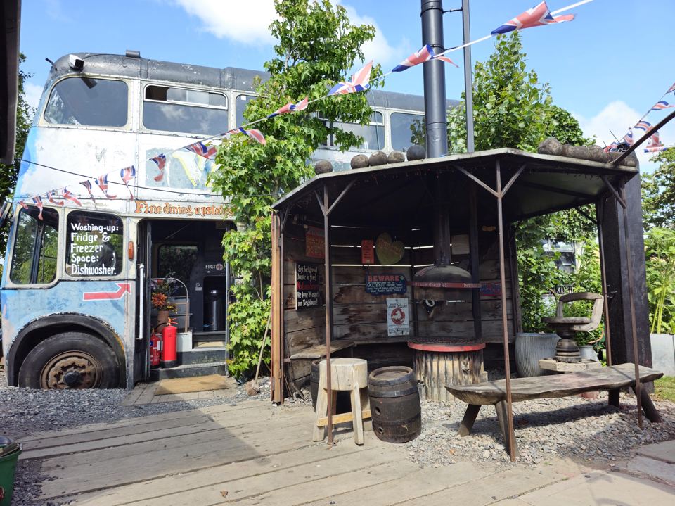 Old bus and covered barbecue