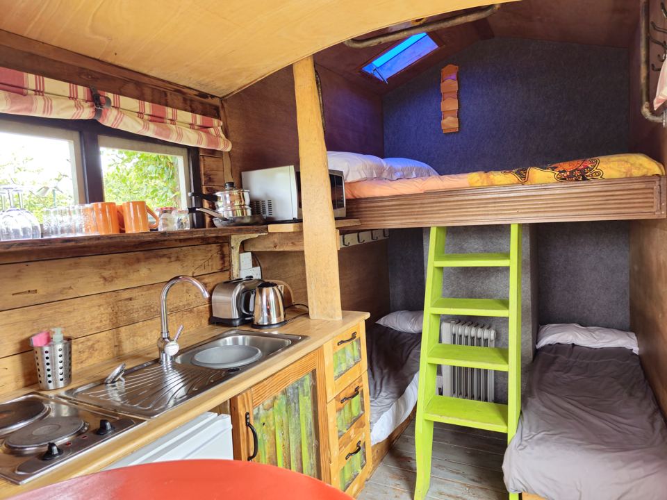 Kitchenette and bunks in a hut